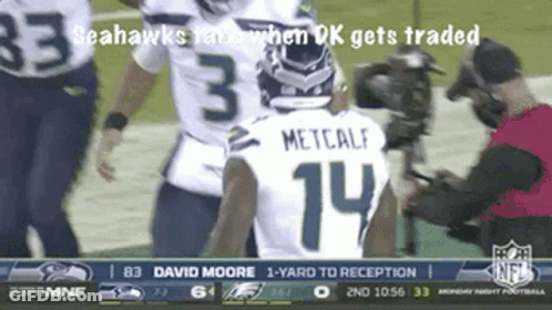 A Seahawks Player With The Number 14 On His Back GIF