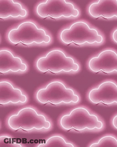 A Seamless Pattern Of Pink Clouds On A Pink Background GIF