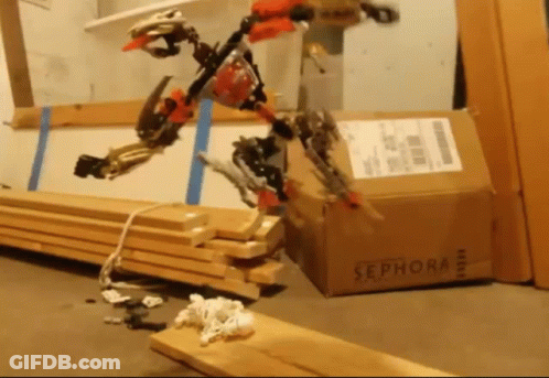 A Sephora Box Sits On The Floor Next To A Stack Of Wood GIF