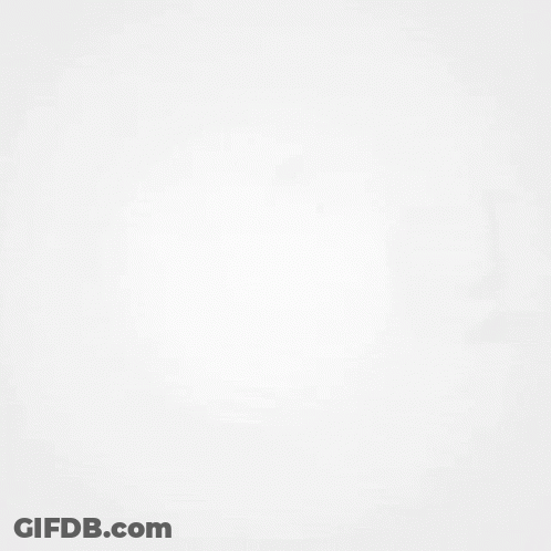 A Shadow Of A Clock Is Cast On A White Surface . GIF