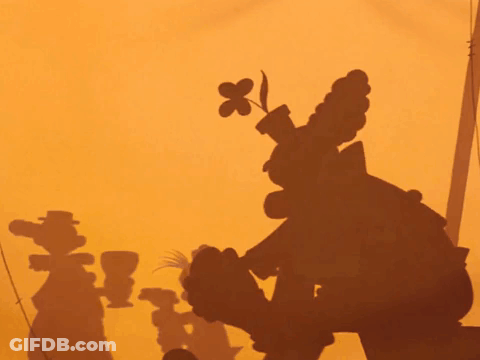 A Shadow Of Goofy Is Cast On A Yellow Wall GIF