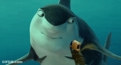 A Shark And A Fish Are Swimming Together In The Water GIF
