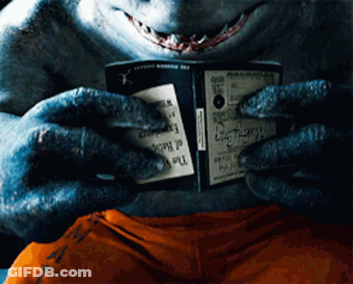 A Shark Is Holding A Book That Says " The Dark Knight " GIF