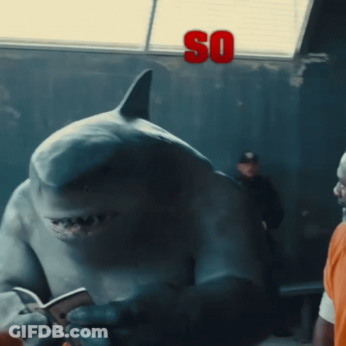 A Shark Is Holding A Cell Phone And The Word So Is Above It GIF