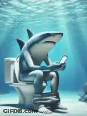 A Shark Is Sitting On A Toilet Underwater Looking At A Cell Phone GIF