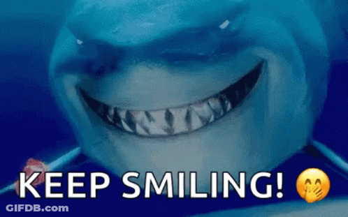 A Shark Is Smiling With The Words Keep Smiling Written Below It GIF