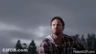 A Shark Is Swimming In Front Of A Building . GIF