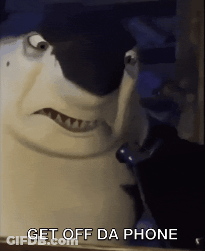 A Shark Talking On A Cell Phone With The Words Get Off Da Phone Below Him GIF