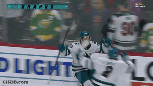 A Sharks Hockey Game Is Being Played In A Stadium GIF