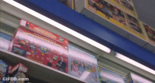A Shelf Full Of Toys Including A Magic Show Box GIF