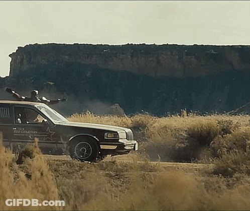 Sheriff's Car Driving Through Field GIF