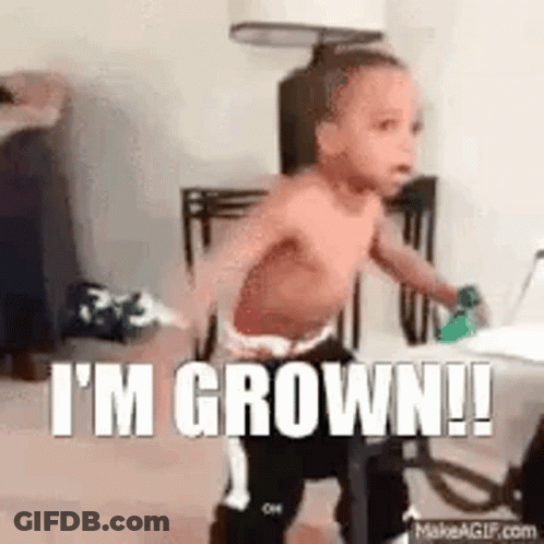A Shirtless Baby Is Standing In A Room With The Words `` I 'M Grown ! '' GIF