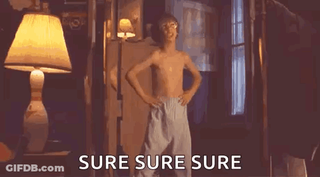 A Shirtless Boy Is Dancing In A Room With The Words `` Sure Sure Sure '' Written Next To Him . GIF