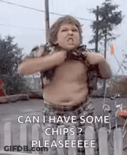 A Shirtless Boy Is Standing In Front Of A Fence . GIF