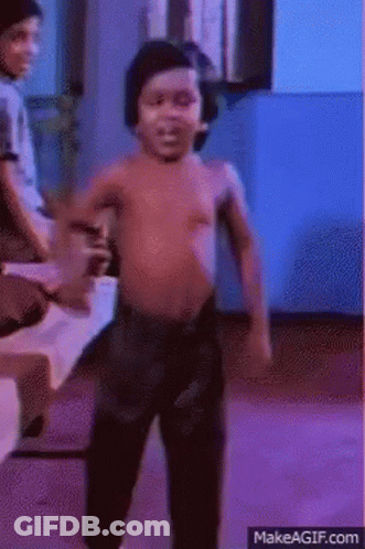 A Shirtless Child Is Dancing In A Room With A Blue Background GIF