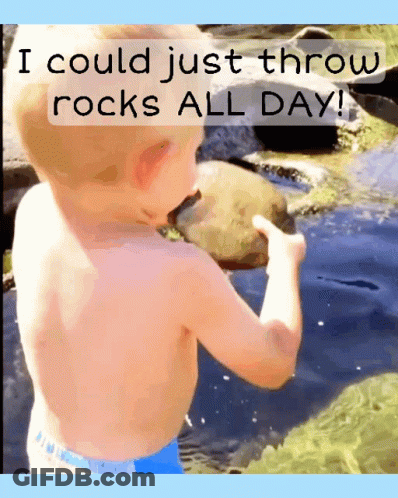 A Shirtless Child Is Holding A Rock In Front Of A River And Says I Could Just Throw Rocks All Day GIF