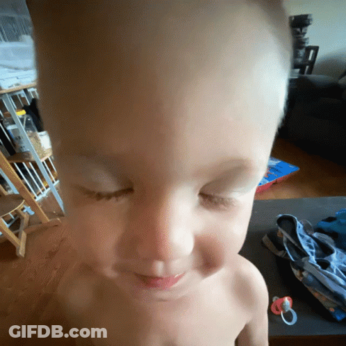 A Shirtless Child With His Eyes Closed And A Pacifier GIF