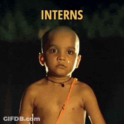 A Shirtless Child With The Word Interns Behind Him GIF