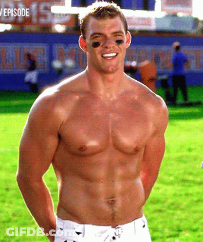 A Shirtless Football Player Stands In Front Of A Sign That Says Episode GIF