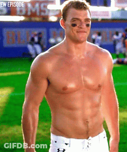 A Shirtless Football Player Stands On A Field With A Bms Sign In The Background GIF