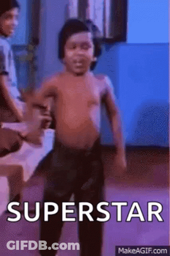 A Shirtless Little Boy Is Dancing In A Room With The Words `` Superstar '' Written On The Bottom . GIF