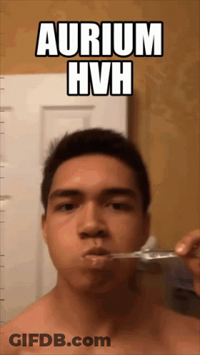 A Shirtless Man Brushing His Teeth With The Words Aurium Hvh Below Him GIF
