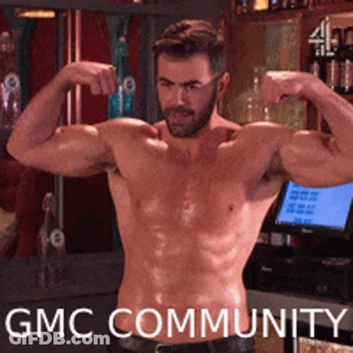 A Shirtless Man Flexes His Muscles In Front Of A Gmc Community Sign GIF