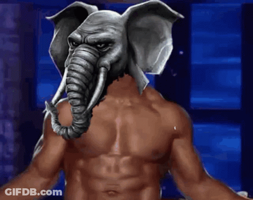 A Shirtless Man Has An Elephant Mask On His Face GIF