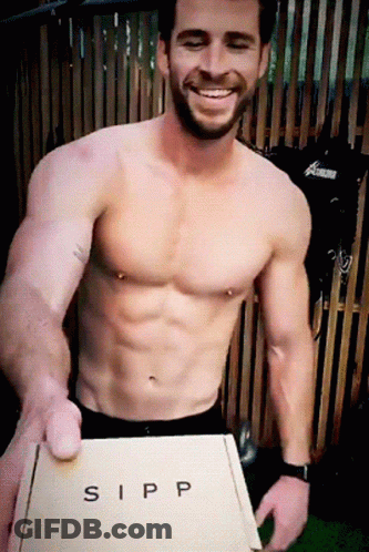 A Shirtless Man Holding A Box That Says Sipp GIF