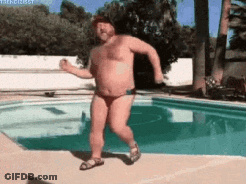 A Shirtless Man In A Bikini Is Dancing Next To A Swimming Pool . GIF