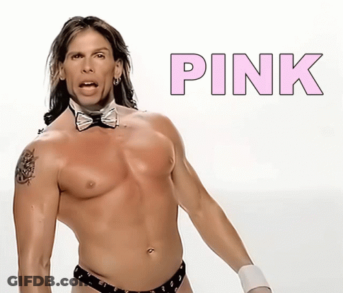 A Shirtless Man In A Bow Tie Is Standing In Front Of A Pink Sign GIF