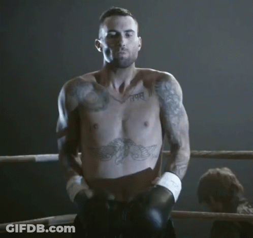 A Shirtless Man In A Boxing Ring Has A Tattoo On His Chest That Says " I Am " GIF