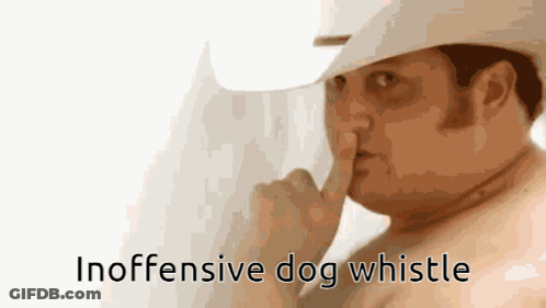 A Shirtless Man In A Cowboy Hat Is Holding His Finger To His Lips And The Words Inoffensive Dog Whistle Are Below Him GIF