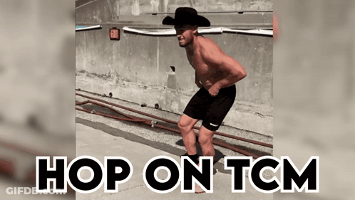 A Shirtless Man In A Cowboy Hat Is Jumping In The Air With The Words Hop On Tcm Above Him GIF