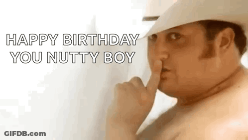 A Shirtless Man In A Cowboy Hat Is Making A Shhh Gesture . GIF
