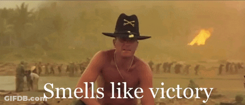 A Shirtless Man In A Cowboy Hat With The Words " Smells Like Victory " Below Him GIF