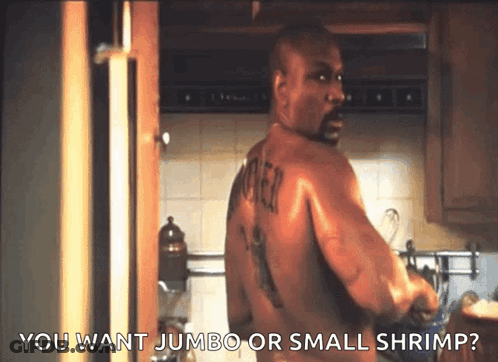 A Shirtless Man In A Kitchen With The Words You Want Jumbo Or Small Shrimp GIF