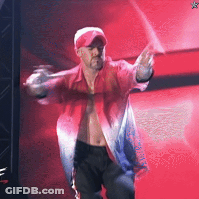 A Shirtless Man In A Red Shirt And Hat Is Dancing On A Stage GIF