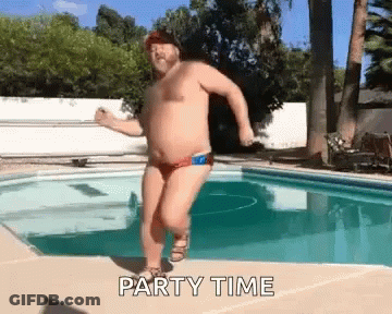 A Shirtless Man In A Red Swim Trunks Is Dancing In A Swimming Pool . GIF