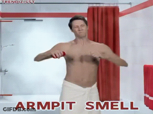 A Shirtless Man In A White Towel Is Applying Deodorant To His Armpits . GIF