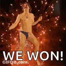 A Shirtless Man In American Flag Underwear Is Dancing In Front Of Fireworks And The Words `` We Won '' . GIF