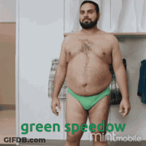 A Shirtless Man In Green Underwear With The Words Green Speedow Mintmobile On The Bottom Right GIF