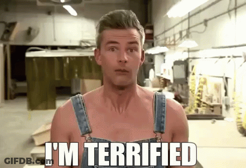 A Shirtless Man In Overalls Says I 'M Terrified In A Workshop GIF