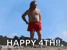 A Shirtless Man In Red Shorts Is Standing On A Beach And Says `` Happy 4Th ! '' GIF