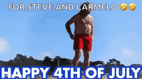 A Shirtless Man In Red Shorts Stands On A Beach With The Words " For Steve And Carmelo Happy 4Th Of July " Above Him GIF