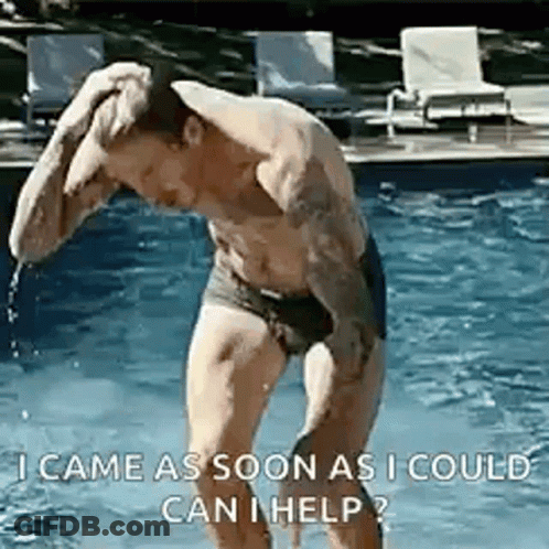 A Shirtless Man In Swim Trunks Is Standing In A Pool . GIF