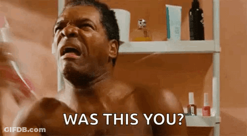 A Shirtless Man Is Brushing His Teeth In A Bathroom And Asking , Was This You ? GIF