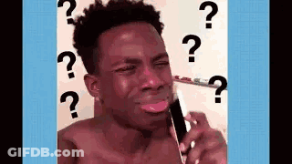 A Shirtless Man Is Crying While Talking On A Cell Phone With Question Marks Around His Head . GIF