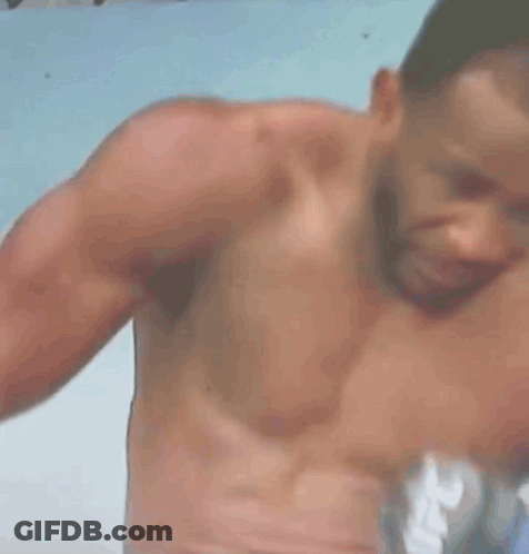 A Shirtless Man Is Crying With A Straw In His Mouth GIF