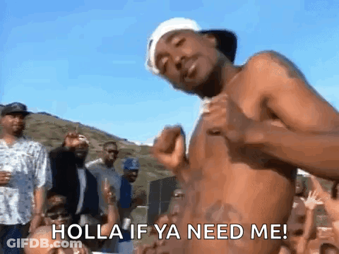 A Shirtless Man Is Dancing In Front Of A Crowd With The Words Holla If Ya Need Me Written On His Chest . GIF